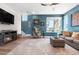 Comfortable living room featuring stylish furniture, a fireplace, and ample natural light at 16351 Askins Loop, Parker, CO 80134