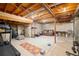 Spacious unfinished basement provides versatile space for recreation, fitness, and storage with exposed wood ceiling at 2773 S Lansing Way, Aurora, CO 80014