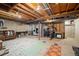 Versatile unfinished basement area offering space for living, laundry, and fitness with concrete walls and exposed ceiling at 2773 S Lansing Way, Aurora, CO 80014