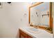 Bathroom vanity featuring a wood frame, white countertop, and sleek faucet at 2773 S Lansing Way, Aurora, CO 80014