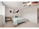 Bright bedroom with ceiling fan, natural light, and cozy furnishings at 2773 S Lansing Way, Aurora, CO 80014