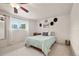 Bedroom with a ceiling fan, a comfortable bed, and a window offering natural light at 2773 S Lansing Way, Aurora, CO 80014