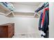Spacious walk-in closet features ample storage, shelving, and a small wooden dresser at 2773 S Lansing Way, Aurora, CO 80014