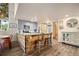 Kitchen features a large island with seating, modern cabinetry, and stainless steel appliances at 2773 S Lansing Way, Aurora, CO 80014