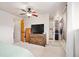 Bright main bedroom features a ceiling fan, flatscreen TV, and convenient access to the shower and closet at 2773 S Lansing Way, Aurora, CO 80014
