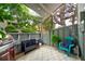 Relaxing patio area with bench, grill, and outdoor furniture, perfect for entertaining guests at 2773 S Lansing Way, Aurora, CO 80014