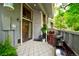 Cozy patio with a diamond-patterned rug, outdoor lighting, grill, and privacy fencing at 2773 S Lansing Way, Aurora, CO 80014