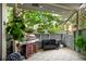 Inviting patio with outdoor furniture, grill, and a view of the lush greenery at 2773 S Lansing Way, Aurora, CO 80014