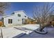 Home's backyard with snow on the ground at 16424 E 107Th Pl, Commerce City, CO 80022