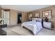 Spacious bedroom with a queen bed and elegant decor at 16424 E 107Th Pl, Commerce City, CO 80022