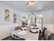 Dining room with table for six, view into Gathering room at 16424 E 107Th Pl, Commerce City, CO 80022