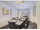 Bright dining room with a large table and wainscoting at 16424 E 107Th Pl, Commerce City, CO 80022