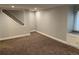 Basement area with carpet, window, and recessed lighting; stairway in background at 7565 S Cove Cir, Centennial, CO 80122