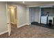 Finished basement featuring carpet, recessed lighting, and access to laundry room and bathroom at 7565 S Cove Cir, Centennial, CO 80122