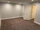 Basement space featuring a door, neutral walls, carpet, and recessed lighting at 7565 S Cove Cir, Centennial, CO 80122