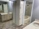 En Suite bathroom featuring double sinks and a shower and tub combination at 7565 S Cove Cir, Centennial, CO 80122