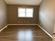 Bedroom featuring modern vinyl plank flooring and neutral walls at 7565 S Cove Cir, Centennial, CO 80122