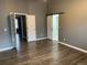 Bedroom boasting modern vinyl floors with an open sliding barn door closet at 7565 S Cove Cir, Centennial, CO 80122
