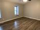 Bedroom featuring new vinyl floors, natural lighting, and neutral colors at 7565 S Cove Cir, Centennial, CO 80122