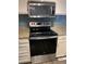 Modern kitchen with stainless steel appliances and blue subway tile backsplash at 7565 S Cove Cir, Centennial, CO 80122