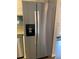 Side-by-side stainless steel refrigerator with water dispenser and ice maker at 7565 S Cove Cir, Centennial, CO 80122