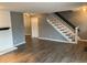 Open living space featuring stylish hardwood floors and an elegant staircase at 7565 S Cove Cir, Centennial, CO 80122