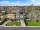 Beautiful aerial view of a two story house surrounded by trees and landscaping at 810 Jasmine St, Denver, CO 80220