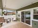 Inviting back porch with outdoor seating and sliding glass door access at 810 Jasmine St, Denver, CO 80220