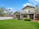 Large backyard featuring a well-maintained lawn and patio area at 810 Jasmine St, Denver, CO 80220