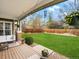 Spacious backyard with covered porch and lush green lawn at 810 Jasmine St, Denver, CO 80220