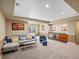 Entertaining basement includes bar area and seating complemented by carpeting, and neutral color scheme at 810 Jasmine St, Denver, CO 80220