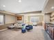 Spacious finished basement with carpeting, bar, and comfortable seating area perfect for entertaining at 810 Jasmine St, Denver, CO 80220