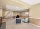 Large basement rec room with carpeting, comfortable seating, and flexible layout for various activities at 810 Jasmine St, Denver, CO 80220