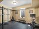 Finished basement area with workout equipment and a window at 810 Jasmine St, Denver, CO 80220