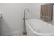 Clean, bright bathroom featuring a luxurious soaking tub and modern fixtures at 810 Jasmine St, Denver, CO 80220