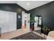 Bedroom featuring dark gray walls, vaulted ceilings and a large decorative mirror at 810 Jasmine St, Denver, CO 80220