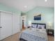 Bedroom featuring light blue walls, vaulted ceilings and a closet at 810 Jasmine St, Denver, CO 80220