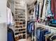 Organized walk-in closet with shelving, hanging rods, and a chandelier at 810 Jasmine St, Denver, CO 80220