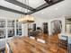 Open floor plan of dining room overlooking the living room with hardwood floors throughout main level at 810 Jasmine St, Denver, CO 80220