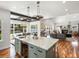 Gourmet kitchen with marble island, stainless steel appliances, and open floor plan to Gathering room at 810 Jasmine St, Denver, CO 80220