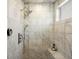 Elegant marble shower with rainfall showerhead, bench, and modern fixtures at 810 Jasmine St, Denver, CO 80220