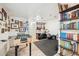 Finished basement featuring a foosball table, gym equipment and built in bookshelves at 1049 Lilac St, Broomfield, CO 80020