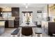 Cozy dining area with a dark wood table, bench, and sliding glass doors, perfect for Gathering gatherings at 1049 Lilac St, Broomfield, CO 80020