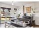 Bright dining area with a rustic table, bench seating, and sliding glass door leading to the backyard at 1049 Lilac St, Broomfield, CO 80020