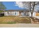 Charming single-story home with a well-manicured lawn and a classic front porch at 1049 Lilac St, Broomfield, CO 80020