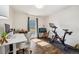 Bright office space features a desk, Peloton, vintage desk and great natural light at 1049 Lilac St, Broomfield, CO 80020
