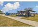 Community playground with picnic shelter, tables, swings, and play equipment amidst green grass and open space at 1049 Lilac St, Broomfield, CO 80020