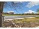 Street view of the neighborhood shows a view of a green space under a partly cloudy sky at 1049 Lilac St, Broomfield, CO 80020