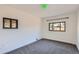 A bedroom with carpeted floors, white walls, and two windows for natural light at 2220 Quebec St, Denver, CO 80207