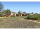 A single story home with xeriscaping; the sidewalk separates two lots at 2220 Quebec St, Denver, CO 80207